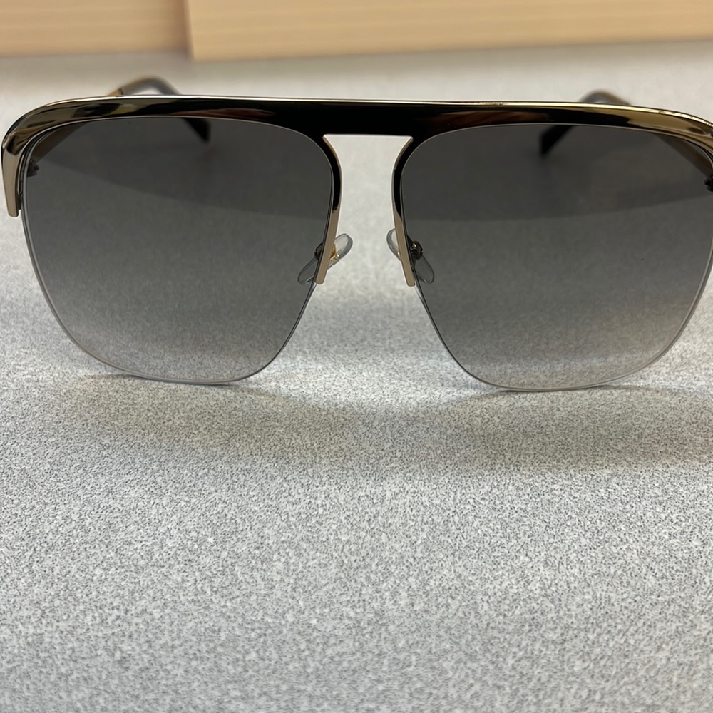 Givenchy- RimlessGold Brown metal oversized unisex sunglasses..